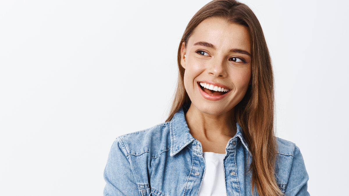 Woman smiling and showing off her straight teeth after orthodontic treatment in Warrington, PA