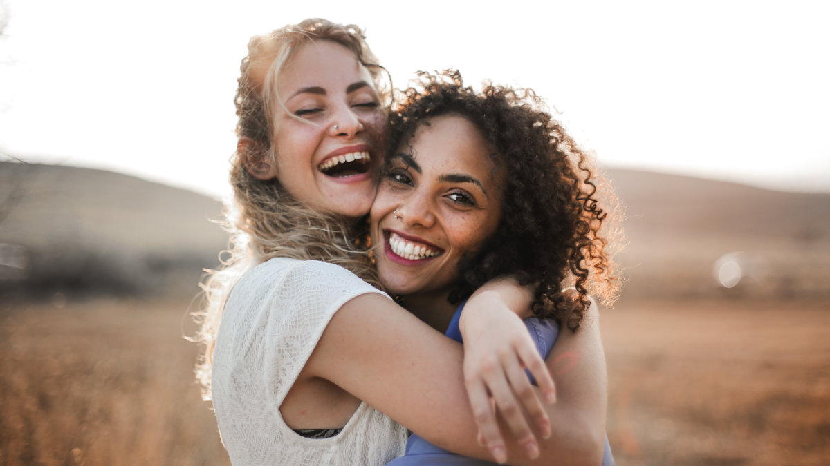 Smiling women hugging